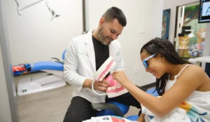 Dr. Jairo Montoya with a pediatric patient at Aviator Dentistry in Watuga, TX.