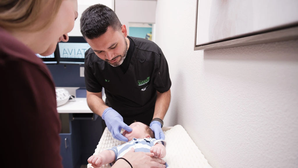 Dr. Jairo Montoya with a pediatric patient at Aviator Dentistry in Watuga, TX.